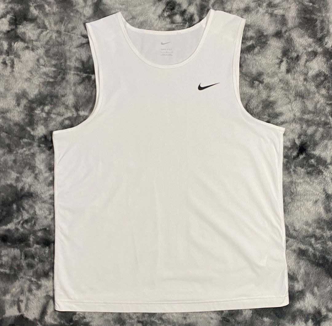Nike Dri-FIT White Training Tank Top Size L (Category: Activewear) located in Sorsogon. Submitted by johnmichae69459 (Listing ID 1470679836, Image 1). Description: - Brand: Nike - Item: Men's Training Tank Top - Color: Crisp White - Size: Large - 22 width - 28 lenght - Material: 100% Dri-FIT Polyester (keeps you cool and dry) - Design: Classic sleeveless cut, crew neckline, and small black Nike swoosh on left chest - Origin: Made in China - Condi