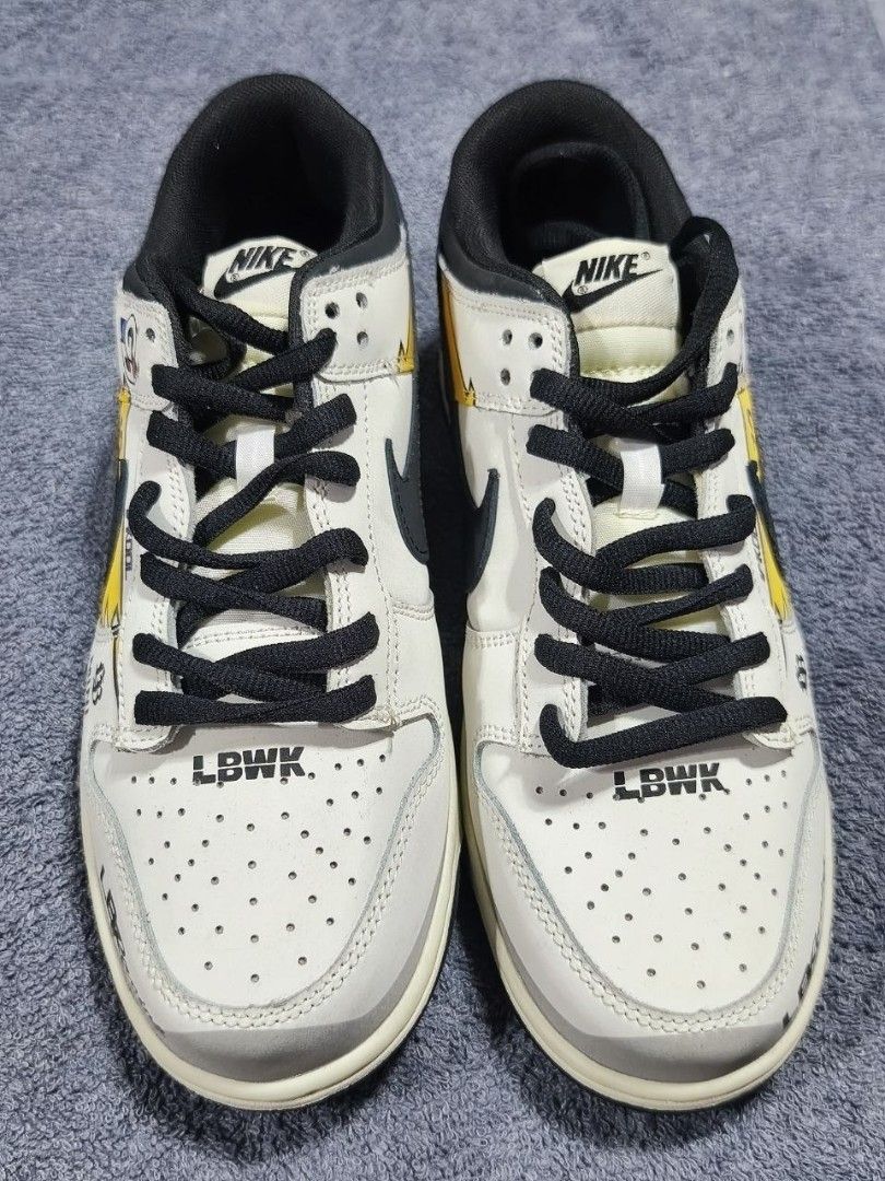 Nike Dunk Low LBWK & BAPE STA Sneakers (Category: Sneakers) located in Manila. Submitted by kikocastro37272 (Listing ID 1470694595, Image 2). Description: - Bundle includes 2 pairs of versatile sneakers, perfect for daily wear and street style - Pair 1: Cream upper, black laces, and striking LBWK text on the toe area - Pair 2: Clean white leather with black accents, BAPE STA tongue branding, and convenient lace locks - Both pairs feature durable 