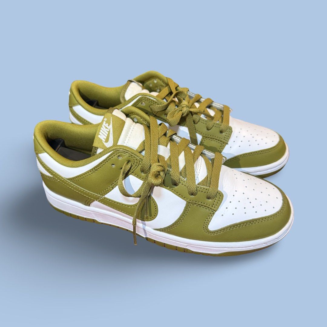 Nike Dunk Low Olive Green White (Category: Sneakers) located in Quezon City. Submitted by chey.mayuga (Listing ID 1470654761, Image 1). Description: - Model: Nike Dunk Low - Colorway: Olive Green / White - Design: Classic low-top with matching green laces and outsole - Materials: White leather base with crisp olive overlays - Details: Clean stitching and signature branding on tongue and heel - Condition: Brand new / Great everyday sneakers - Meet