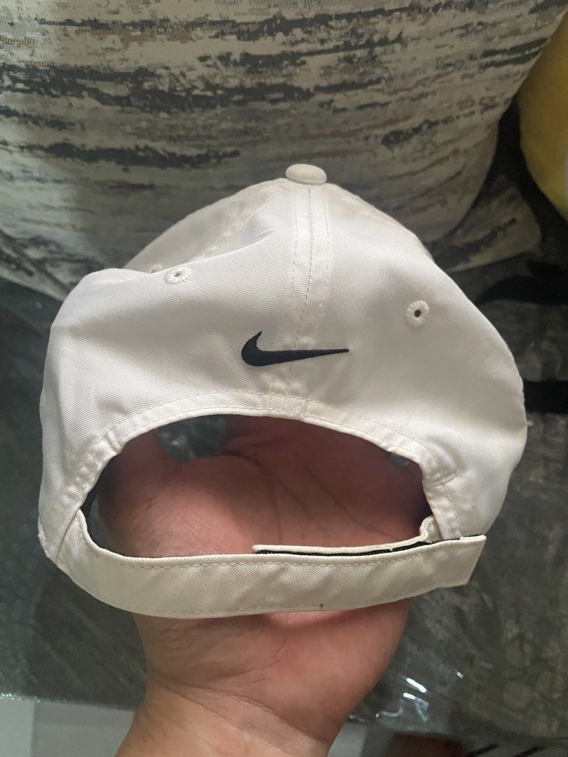 Nike Golf White Cap with Black Piping (Category: Caps & Hats) located in Angeles City. Submitted by lukemafinds (Listing ID 1470598463, Image 2). Description: - Brand: Nike Golf - Color: White with black piping details - Logos: Embroidered Swoosh on front and back - Fit: Adjustable velcro strap, one size fits most - Origin: Made in Vietnam - Versatile for sports or daily casual wear -original -good for golfing and pamorma -699 only.