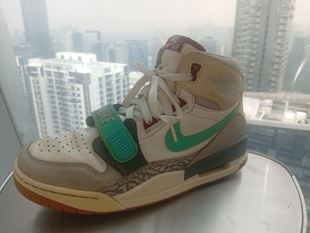 Nike Jordan Legacy 312 Ghost Green (Category: Sneakers) located in Manila. Submitted by kramchelle (Listing ID 1470723600, Image 2). Description: - Model: Nike Jordan Legacy 312 High - Colorway: White leather with grey mudguards, elephant print overlays, teal swooshes, and bright green forefoot strap - Features: Exposed air unit in midsole, gum rubber outsole, and signature Jumpman branding on the heel - Condition: Minor creasing with light wear 