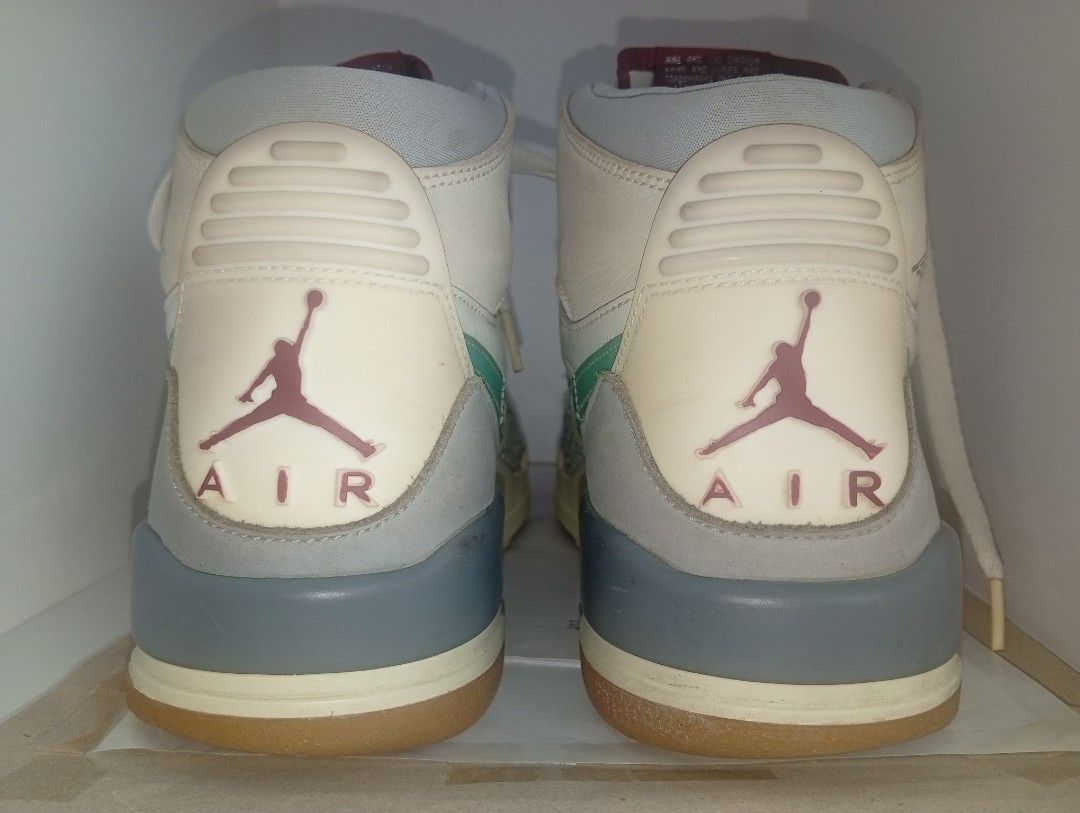 Nike Jordan Legacy 312 Ghost Green (Category: Sneakers) located in Manila. Submitted by kramchelle (Listing ID 1470723600, Image 3). Description: - Model: Nike Jordan Legacy 312 High - Colorway: White leather with grey mudguards, elephant print overlays, teal swooshes, and bright green forefoot strap - Features: Exposed air unit in midsole, gum rubber outsole, and signature Jumpman branding on the heel - Condition: Minor creasing with light wear 