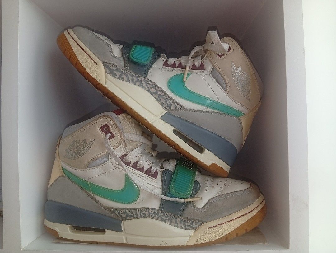 Nike Jordan Legacy 312 Ghost Green (Category: Sneakers) located in Manila. Submitted by kramchelle (Listing ID 1470723600, Image 1). Description: - Model: Nike Jordan Legacy 312 High - Colorway: White leather with grey mudguards, elephant print overlays, teal swooshes, and bright green forefoot strap - Features: Exposed air unit in midsole, gum rubber outsole, and signature Jumpman branding on the heel - Condition: Minor creasing with light wear 