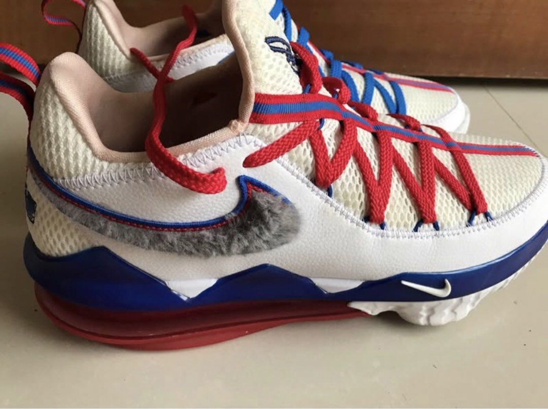 Nike LeBron 18 Low Space Jam Tune Squad (Category: Sneakers) located in Iloilo. Submitted by romeocajab44507 (Listing ID 1470695862, Image 2). Description: - Model: Nike LeBron 18 Low - Colorway: White, blue, and red with a unique fuzzy grey swoosh - Details: Mismatched red and blue laces, embroidered LeBron crown logo on heel and tongue - Lining: Fun Wile E Coyote graphics printed on the inner collar - Cushioning: Clear red Air Max unit in the s