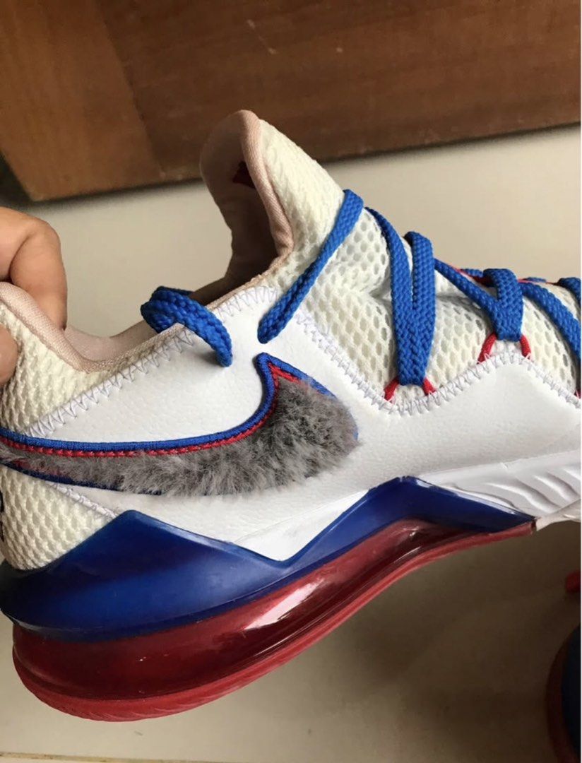 Nike LeBron 18 Low Space Jam Tune Squad (Category: Sneakers) located in Iloilo. Submitted by romeocajab44507 (Listing ID 1470695862, Image 3). Description: - Model: Nike LeBron 18 Low - Colorway: White, blue, and red with a unique fuzzy grey swoosh - Details: Mismatched red and blue laces, embroidered LeBron crown logo on heel and tongue - Lining: Fun Wile E Coyote graphics printed on the inner collar - Cushioning: Clear red Air Max unit in the s