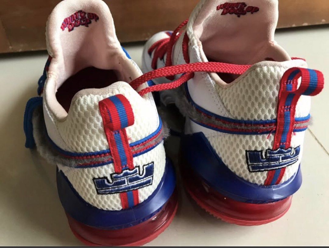 Nike LeBron 18 Low Space Jam Tune Squad (Category: Sneakers) located in Iloilo. Submitted by romeocajab44507 (Listing ID 1470695862, Image 1). Description: - Model: Nike LeBron 18 Low - Colorway: White, blue, and red with a unique fuzzy grey swoosh - Details: Mismatched red and blue laces, embroidered LeBron crown logo on heel and tongue - Lining: Fun Wile E Coyote graphics printed on the inner collar - Cushioning: Clear red Air Max unit in the s