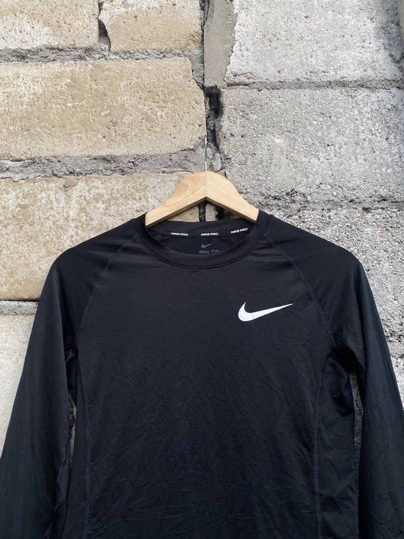 Nike Pro Dri-Fit Long Sleeve Compression Top Black Medium (Category: Activewear) located in Candaba. Submitted by dejesus.bench17 (Listing ID 1470727453, Image 3). Description: - Brand: Nike Pro - Size: Medium - Color: Black with white swoosh - Material: Dri-Fit for sweat-wicking comfort - Fit: Tight fit design - Features: Wrapping sleeve swoosh, branded inner collar and back neck - Origin: Made in Indonesia -Excellent as new -Dimes: W16 L27.