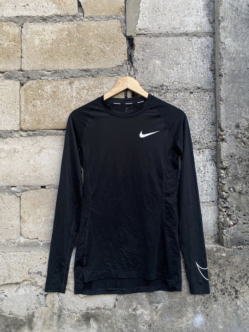 Nike Pro Dri-Fit Long Sleeve Compression Top Black Medium (Category: Activewear) located in Candaba. Submitted by dejesus.bench17 (Listing ID 1470727453, Image 1). Description: - Brand: Nike Pro - Size: Medium - Color: Black with white swoosh - Material: Dri-Fit for sweat-wicking comfort - Fit: Tight fit design - Features: Wrapping sleeve swoosh, branded inner collar and back neck - Origin: Made in Indonesia -Excellent as new -Dimes: W16 L27.