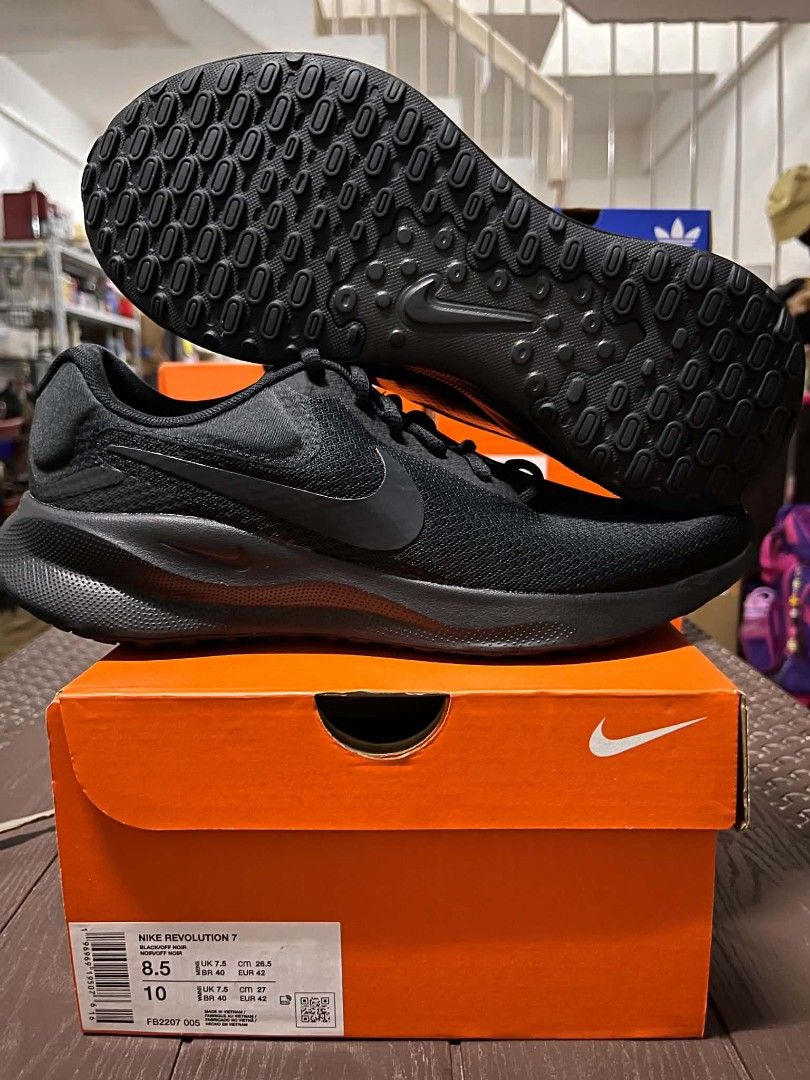Nike Revolution 7 Running Shoes (Category: Sneakers) located in Caloocan City. Submitted by savastrid (Listing ID 1470596674, Image 3). Description: - Authentic Nike Revolution 7 running shoes - Breathable mesh upper keeps your feet cool - Cushioned midsole for all-day comfort during workouts or casual walks - Durable rubber outsole for reliable traction - Comes with the original orange Nike shoebox - Multiple colorways and sizes available (DM to