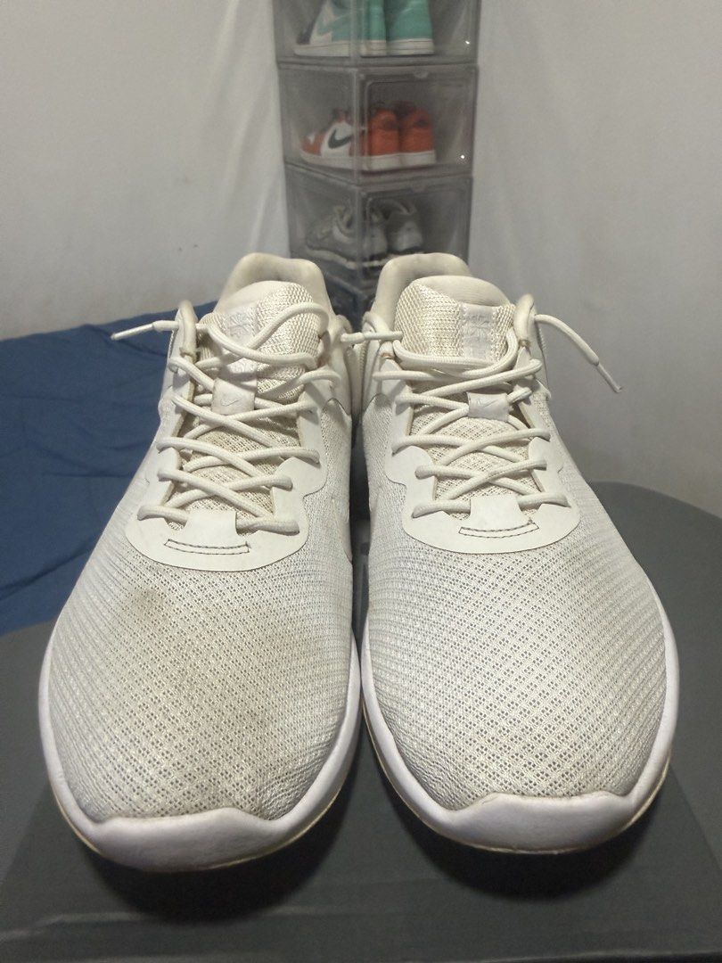 Nike Running Shoes White (Category: Sneakers) located in Manila. Submitted by riyhun (Listing ID 1470696098, Image 2). Description: - Brand: Nike - Color: White - Style: Running sneakers - Upper: Breathable mesh material with traditional lace-up closure - Midsole: Textured white foam with cushioning support inside - Outsole: Durable rubber with pattern grip - Condition: Minor scuffs and dirt marks on the midsole and toe area.