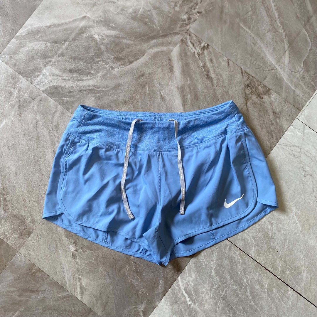 Nike Running Shorts Light Blue (Category: Shorts) located in Butuan. Submitted by jc13thrifts (Listing ID 1470617206, Image 1). Description: - Light blue Nike running shorts, great for workouts and jogs - Wide heather blue waistband with Nike Running text drawstrings - Convenient back zippered pocket for cards and keys - Reflective Swoosh logo for visibility - Lightweight, breathable material.