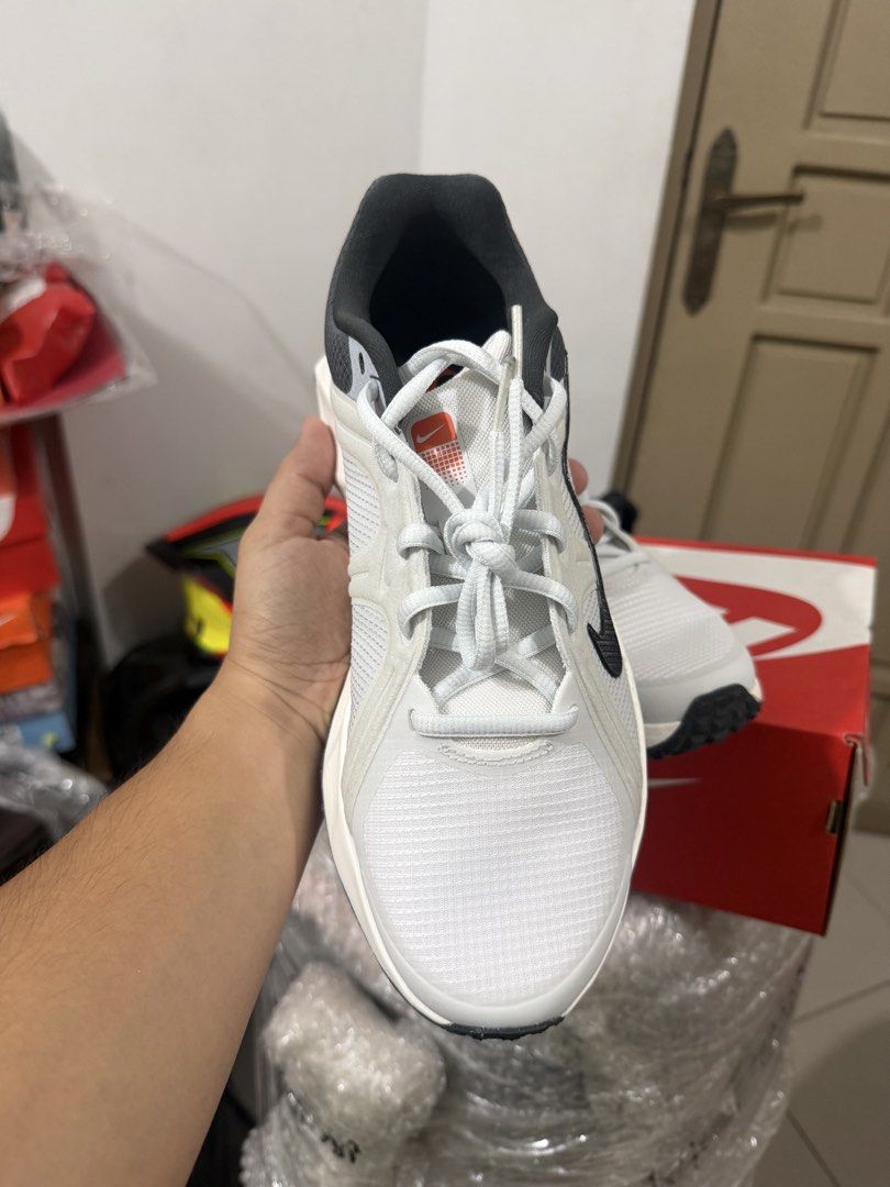 Nike sneakers in white and black (Category: Sneakers) located in Marikina City. Submitted by epicdog_9746d4 (Listing ID 1470595905, Image 3). Description: - Brand: Nike - Color: White, black, and grey with orange accents - Condition: Brand new, never worn, clean - Features: Breathable mesh upper, bold swoosh branding, thick chunky midsole, black rubber outsole, and MTK 001 heel tab - Packaging: Comes in original Nike red shoebox with packing pape