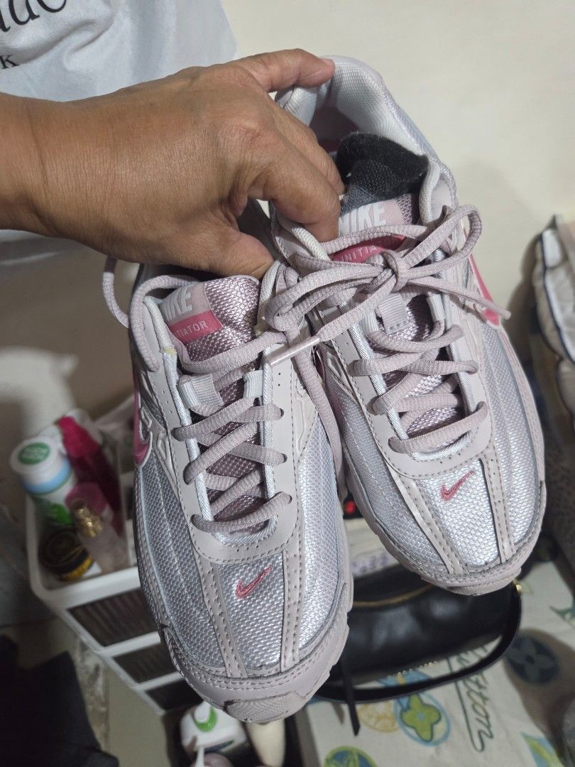 Nike Sneakers Pink Size US 6.5 (Category: Sneakers) located in Manila. Submitted by analiepagl91301 (Listing ID 1470675345, Image 2). Description: - Brand: Nike - Color: Light Pink - Size: US Women's 6.5 - Style Code: 394053-009 - Material: Breathable mesh upper with a comfortable padded collar - Insole: Pink cushioned insole with classic white Nike swoosh logo - Condition: Clean interior, well-maintained, and ready to wear.
