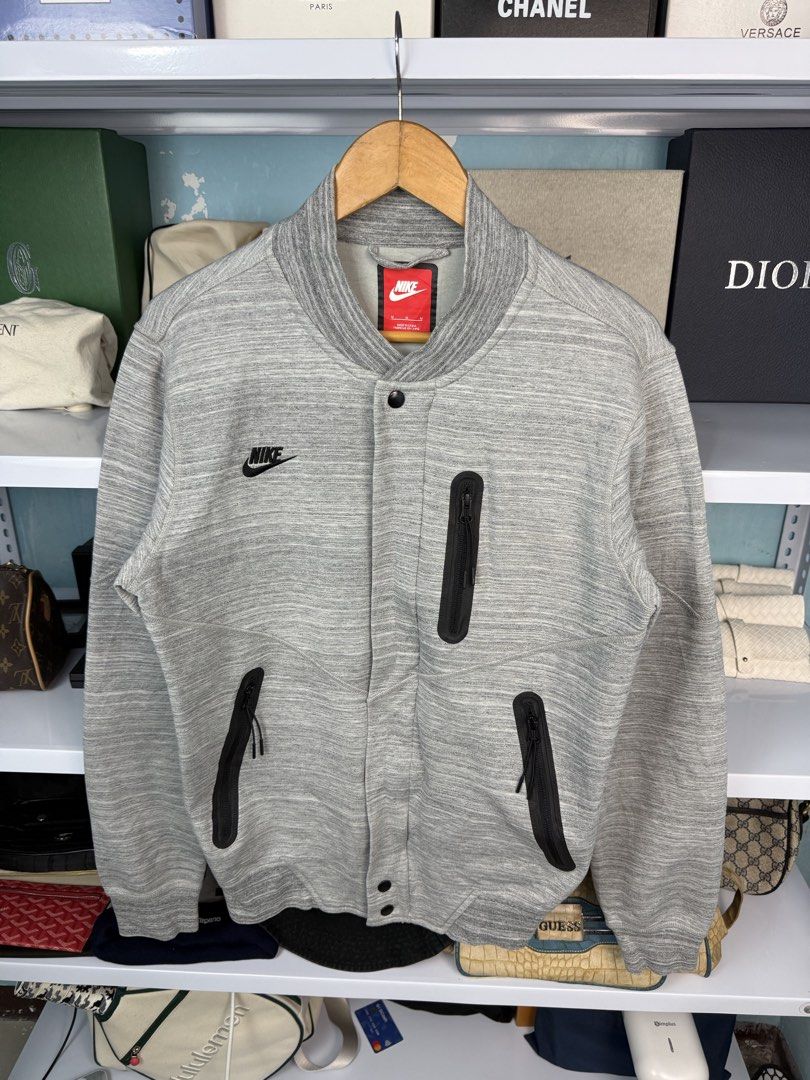 NIKE TECHFLEECE (Category: Coats, Jackets and Outerwear) located in Quezon City. Submitted by generalmerchandiseph (Listing ID 1470735378, Image 3). Description: - NIKE TECHFLEECE VARSITY JACKET - HEATHER GREY COLORWAY - MULTI LAYER TECH MATERIAL - ZIP UP AND SNAP BUTTON - 20.5W X 27L DIMENSIONS - MEDIUM MENS BEST FIT - EXCELLENT USED CONDITION - HONGKONG / JAPAN SOURCE ✈️ - WASHED AND READY TO WEAR 🫧.