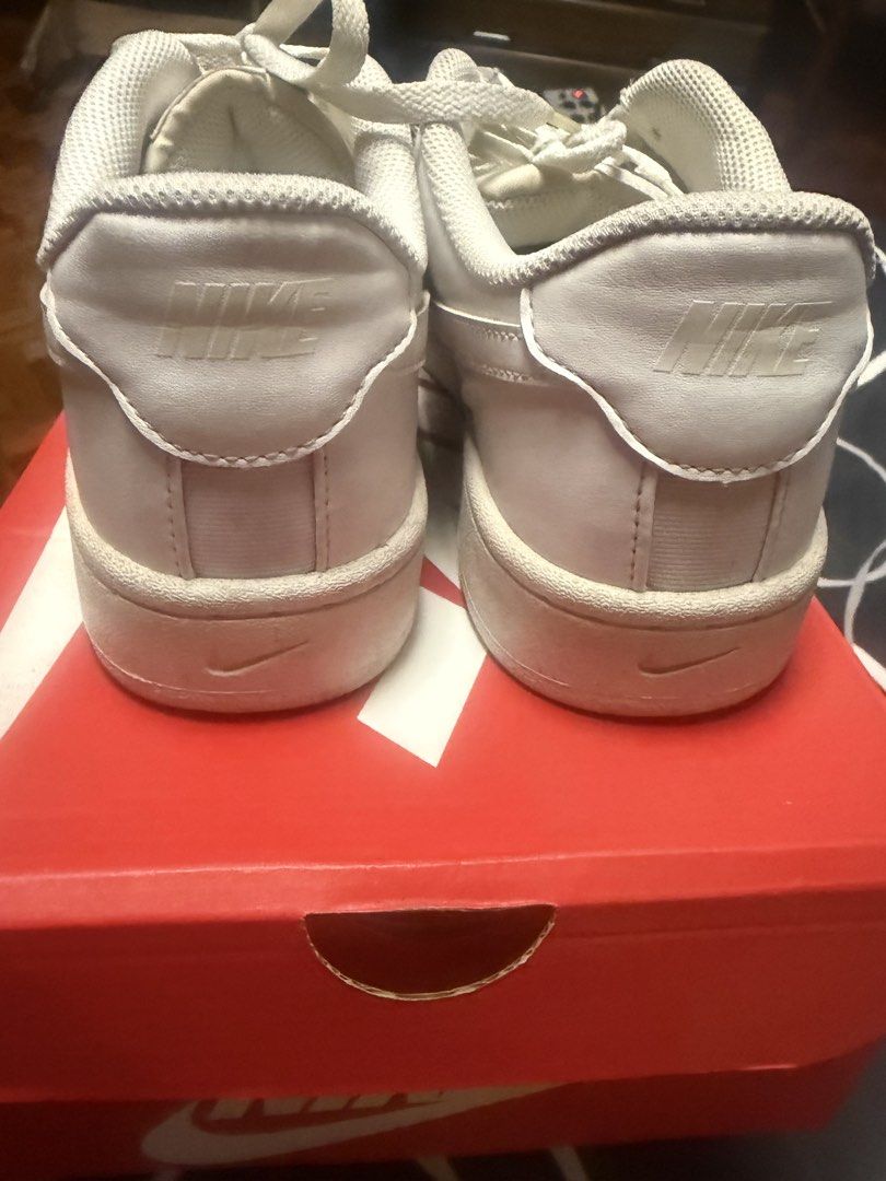 Nike White Casual Sneakers with Original Box (Category: Sneakers) located in Quezon City. Submitted by d8bhk9y4rs (Listing ID 1470651517, Image 3). Description: - Brand: Nike Court - Style: Classic everyday leather sneaker - Color: Clean white with matching laces - Included: Original red box - Condition: Good pre-loved condition with minor toe creases and light sole wear along the edges - Size: Message to inquire.