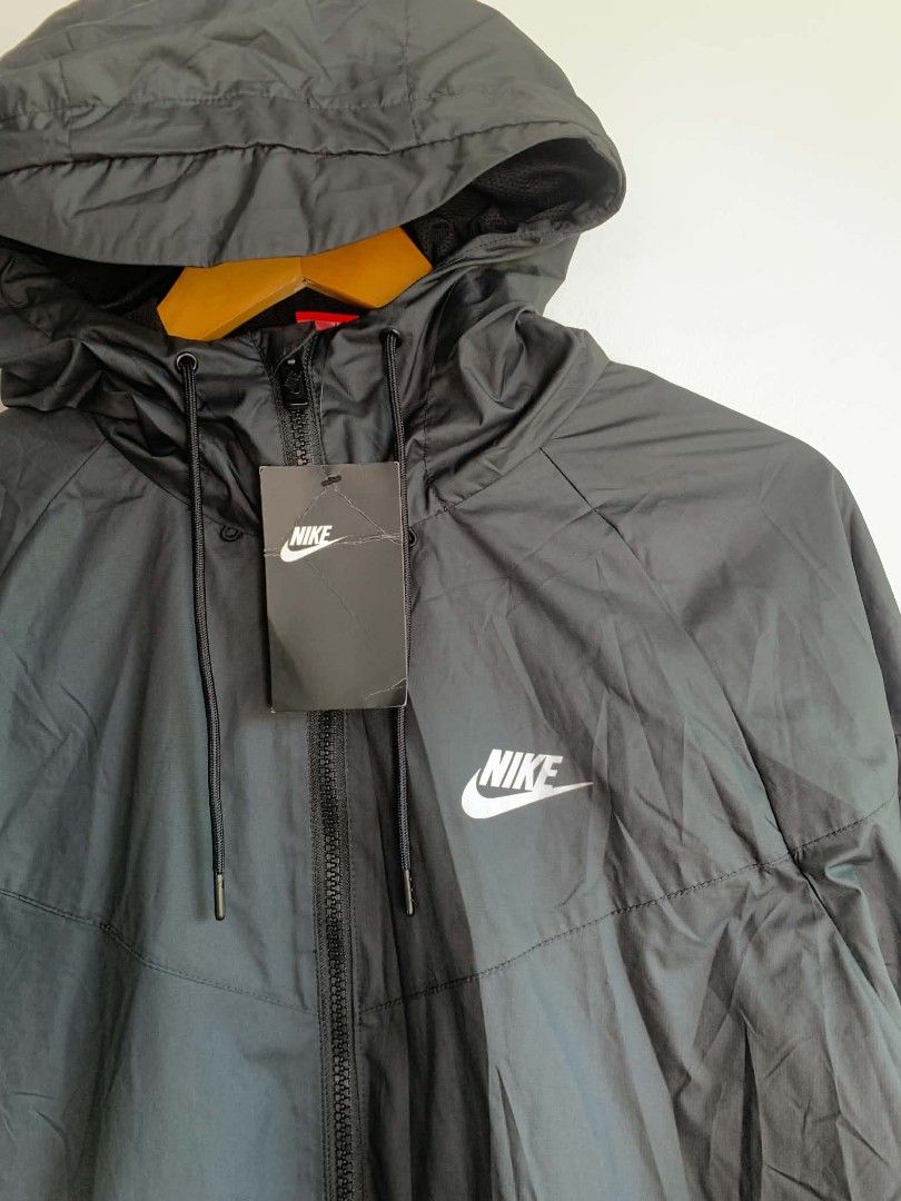 Nike Windrunner Black Jacket Size M (Category: Coats, Jackets and Outerwear) located in Manila. Submitted by michaelge38472 (Listing ID 1470704109, Image 2). Description: - Brand: Nike - Style: Black Hooded Windrunner Jacket - Size: Medium - Condition: Clean, brand new with original tag attached - Material: 100% polyester body and lining with breathable mesh interior - Features: Full zip front, side zip pockets, and adjustable hood drawstrings.