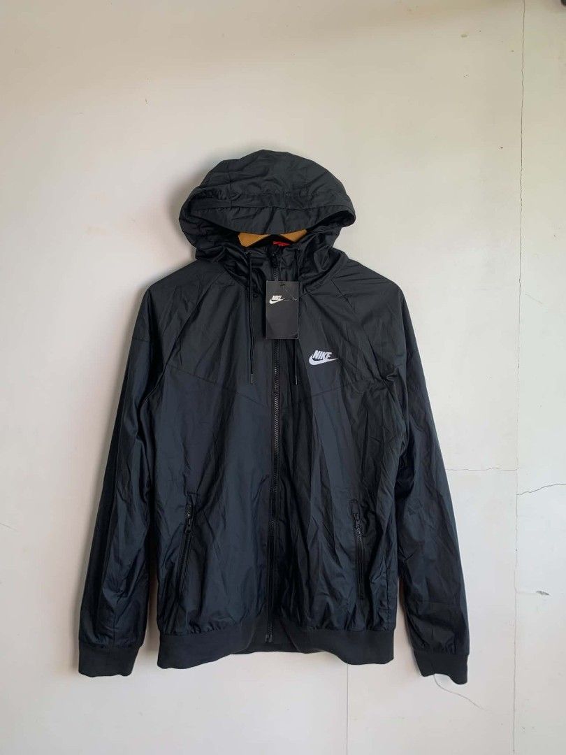 Nike Windrunner Black Jacket Size M (Category: Coats, Jackets and Outerwear) located in Manila. Submitted by michaelge38472 (Listing ID 1470704109, Image 1). Description: - Brand: Nike - Style: Black Hooded Windrunner Jacket - Size: Medium - Condition: Clean, brand new with original tag attached - Material: 100% polyester body and lining with breathable mesh interior - Features: Full zip front, side zip pockets, and adjustable hood drawstrings.
