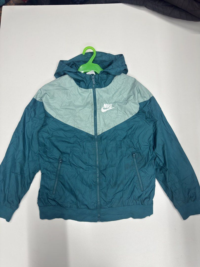Nike Windrunner Jacket Teal Green Size L (Category: Coats, Jackets and Outerwear) located in Bustos. Submitted by thenlnclot60500 (Listing ID 1470632898, Image 1). Description: - Brand: Nike - Style: Windrunner Jacket - Color: Teal and Light Green - Size: Large - Style Number: 850443-381 - Condition: Brand new with tags attached - Material: 100% Polyester body and mesh lining - Features: Full zip closure, attached hood, and two zippered side pock