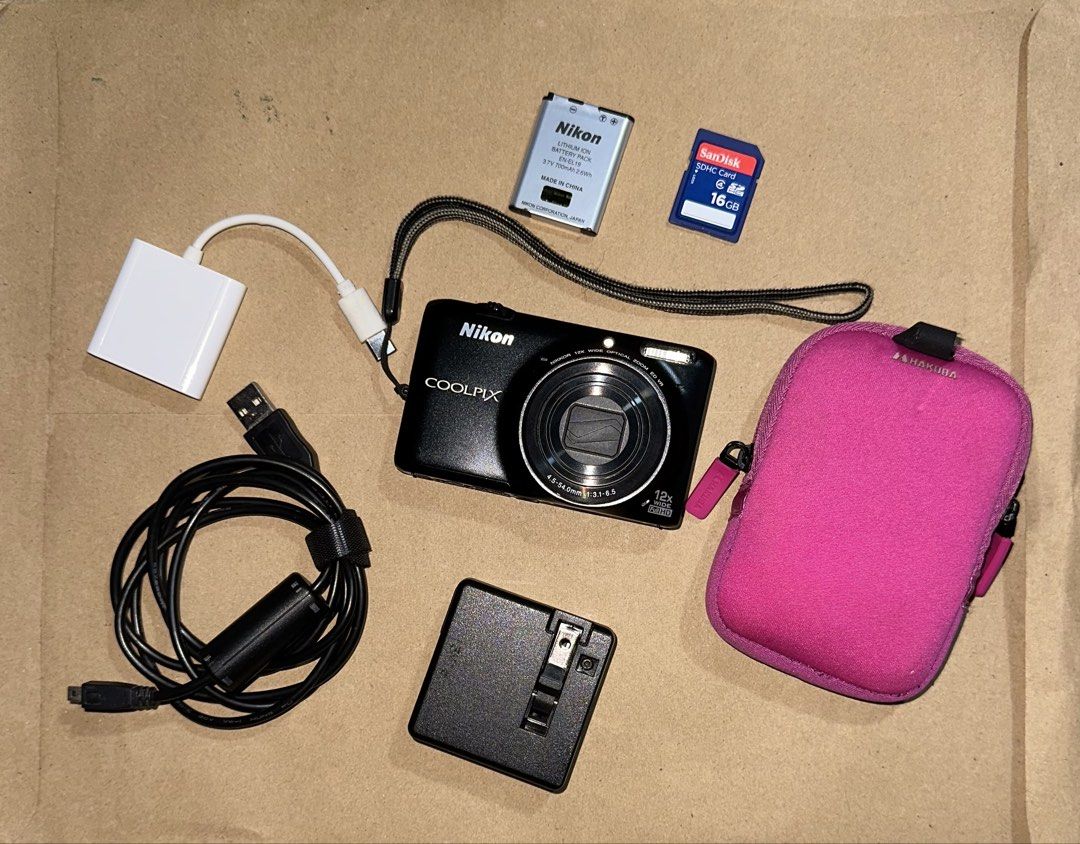 Nikon Coolpix S6500 Digital Camera Bundle with Accessories (Category: Cameras) located in Taytay. Submitted by lloyd_0514 (Listing ID 1470652561, Image 2). Description: - Brand: Nikon Coolpix Compact Digital Camera (Black) - Features: 12x optical zoom & Full HD video capability - Condition: Powers on and functions properly; screen has minor surface wear from normal use - Included Accessories: 16GB SanDisk SDHC card, Nikon rechargeable battery, ex
