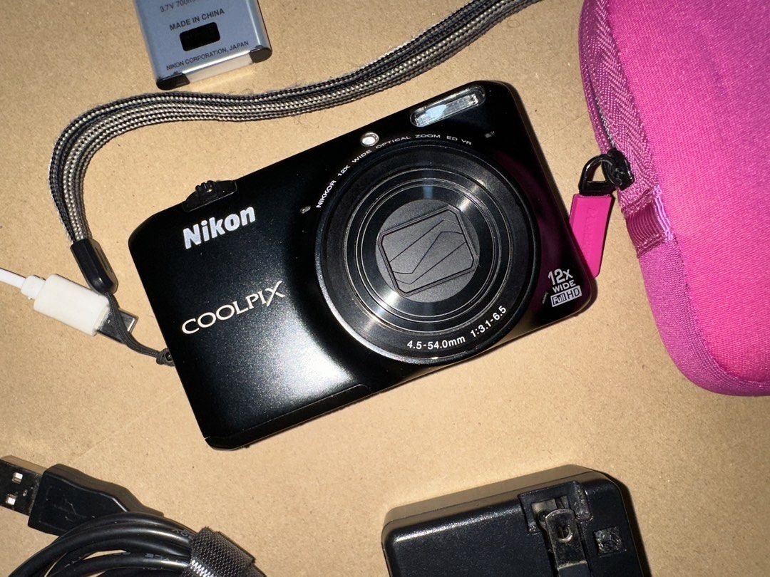 Nikon Coolpix S6500 Digital Camera Bundle with Accessories (Category: Cameras) located in Taytay. Submitted by lloyd_0514 (Listing ID 1470652561, Image 1). Description: - Brand: Nikon Coolpix Compact Digital Camera (Black) - Features: 12x optical zoom & Full HD video capability - Condition: Powers on and functions properly; screen has minor surface wear from normal use - Included Accessories: 16GB SanDisk SDHC card, Nikon rechargeable battery, ex