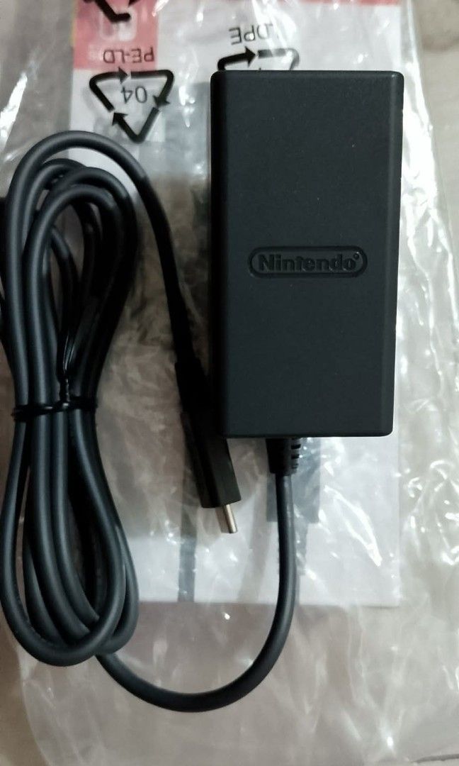 NINTENDO SWITCH AC CHARGER ADAPTOR. (Category: Cables & Chargers) located in Quezon City. Submitted by hajjasittienor (Listing ID 1470702076, Image 2). Description: BRAND NEW NINTENDO SWITCH AC CHARGER ADAPTOR FOR OLED.LITE.VERSION 1,2 ..PWEDE PICK UP ..PWEDE GCASH AVIDA TOWER NEW MANILA COL BONNY SERRANO AVE QC.