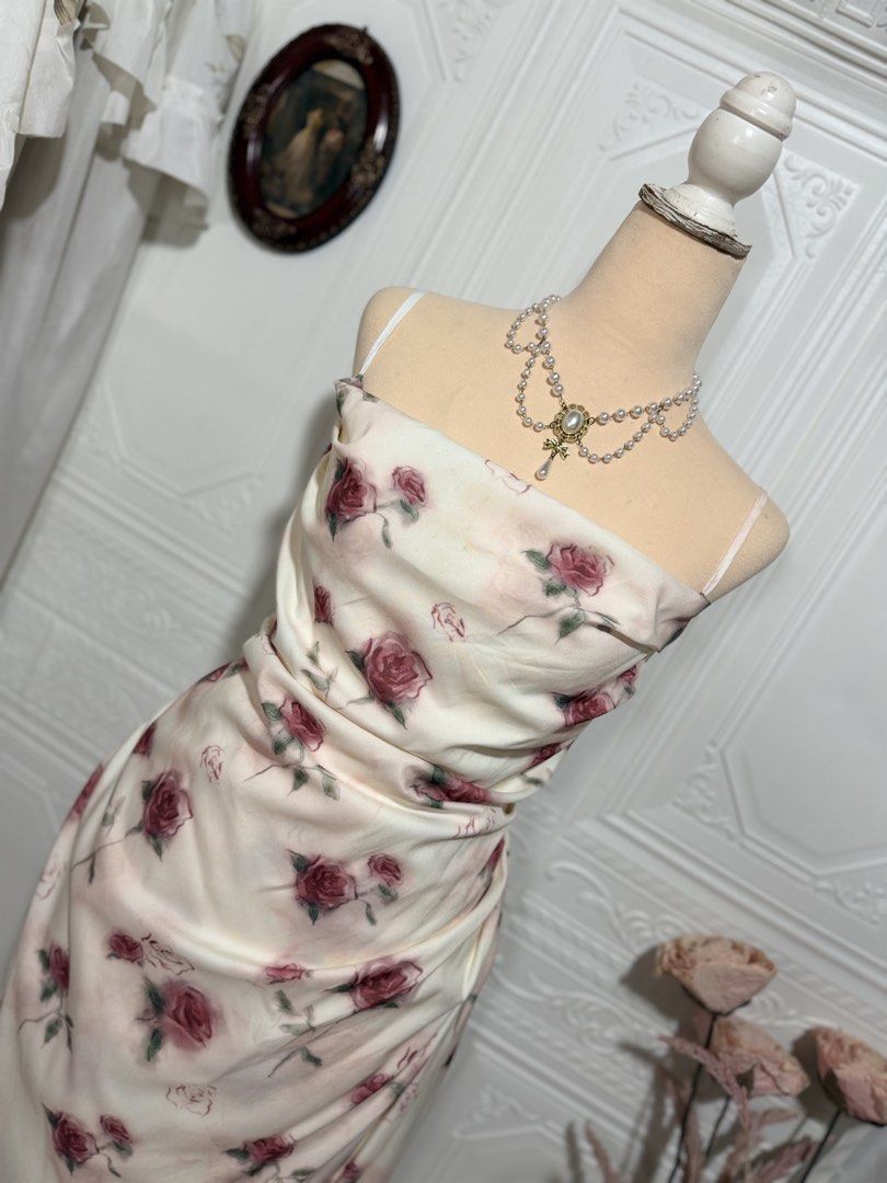 Off-white Red Rose Print Ruched Maxi Dress (Category: Dresses) located in San Jose. Submitted by vintagely_retro (Listing ID 1470639313, Image 2). Description: With lining | side zip | side slit Measurements: Frame Medium-Large Bust 34-38” Waist 30-32” Length 46-47”.