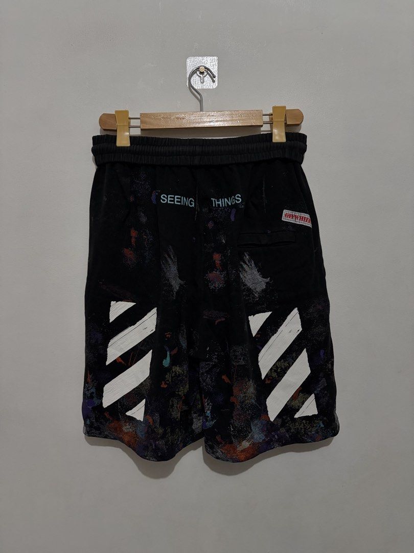 Off-White Seeing Things Galaxy Paint Splatter Shorts (Category: Shorts) located in Quezon City. Submitted by Tyler_brown (Listing ID 1470699386, Image 2). Description: - Brand: Off-White - Color/Design: Black with multi-color galaxy paint splatter wash - Material: Heavy cotton fleece for maximum comfort - Details: White diagonal stripe prints on front and back legs, 'SEEING THINGS' text near right rear waistband - Features: Elastic drawstring wai