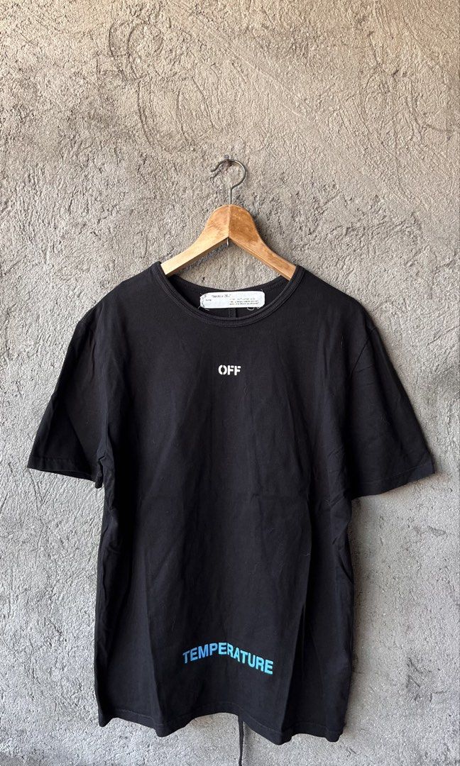 Off-White Temperature Black T-Shirt Spring-Summer 2018 (Category: Tshirts & Polo Shirts ) located in Cabuyao City. Submitted by bulandos (Listing ID 1470653354, Image 1). Description: Off-White Temperature black t-shirt from the Spring-Summer 2018 collection. Small Off logo on the chest, bold temperature graphics and diagonal stripes on the back. Blue temperature text accents. Classic crew neck short sleeve fit. Made in China, 100 percent cotton 