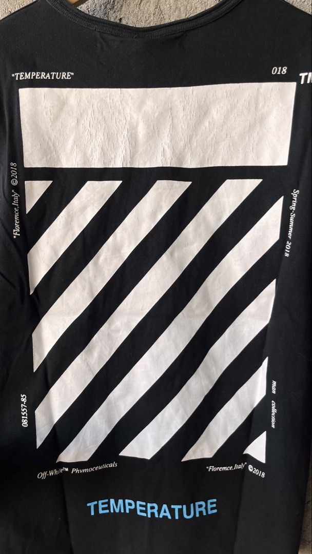 Off-White Temperature Black T-Shirt Spring-Summer 2018 (Category: Tshirts & Polo Shirts ) located in Cabuyao City. Submitted by bulandos (Listing ID 1470653354, Image 3). Description: Off-White Temperature black t-shirt from the Spring-Summer 2018 collection. Small Off logo on the chest, bold temperature graphics and diagonal stripes on the back. Blue temperature text accents. Classic crew neck short sleeve fit. Made in China, 100 percent cotton 