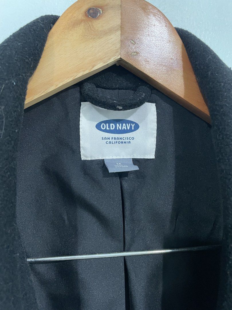 Old Navy Black Wool Blend Coat (Category: Coats, Jackets and Outerwear) located in Las Pinas. Submitted by archivedfinds (Listing ID 1470705188, Image 2). Description: - Brand: Old Navy - Color: Classic Black - Size: Medium - Material: 63% polyester, 27% recycled wool, 6% rayon, 4% other fibers (Fully lined) - Closure: Single button front - Pockets: Two side pockets - Care: Dry clean only - Condition: Excellent No pilling- just lint M on tag but 