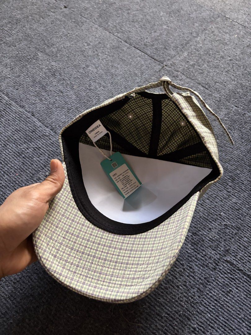 ONEIDEA Plaid Cap with Bear Embroidery (Category: Caps & Hats) located in Manila. Submitted by toys_hats005 (Listing ID 1470628397, Image 3). Description: - Brand: ONEIDEA - Design: Green and purple plaid pattern with front embroidered bear graphic and 'GOOD LUCK 1990' text - Structure: Structured panels with a curved brim - Fit: Adjustable strap back with metal slider for a custom fit - Details: Includes inner sweatband and original brand tags -