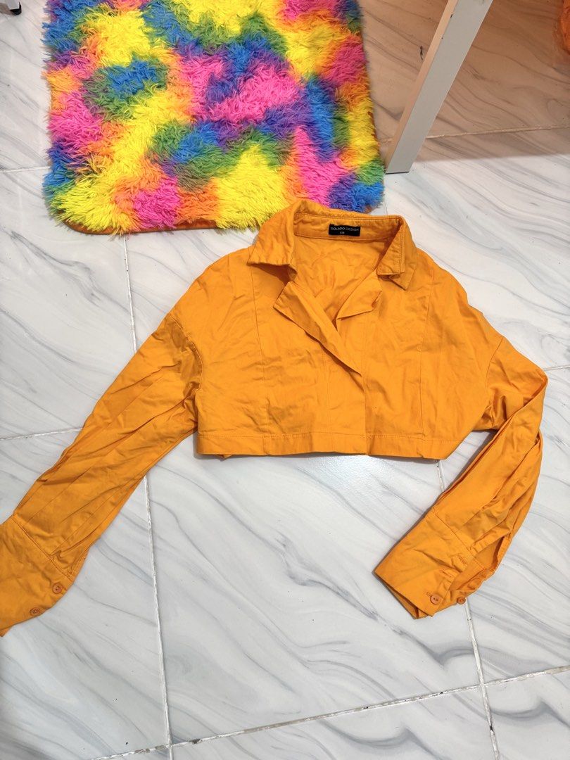 Orange Cropped Button Longsleeves Top (Category: Longsleeves) located in Bulacan. Submitted by archivesbyjanine (Listing ID 1470680402, Image 1). Description: Makapal tela.