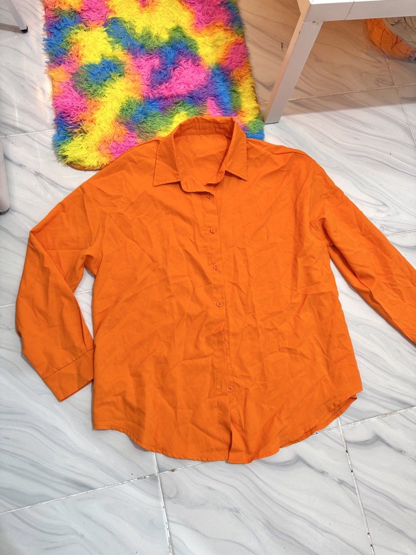 Orange Polo Longsleeves (Category: Longsleeves) located in Bulacan. Submitted by archivesbyjanine (Listing ID 1470681860, Image 1). Description: M-L Oversized for xs-s frame.