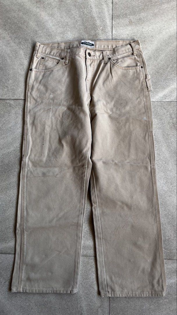 Orchard Supply Hardware Tan Canvas Carpenter Pants (Category: Jeans) located in Cabuyao City. Submitted by bulandos (Listing ID 1470657068, Image 2). Description: - Brand: Orchard Supply Hardware - Material: Heavy-duty tan duck canvas - Style: Utility carpenter pants with relaxed fit - Features: Multiple tool pockets, hammer loop, and reinforced stitching - Condition: Authentic workwear with genuine paint splatters and stains on lower legs and th