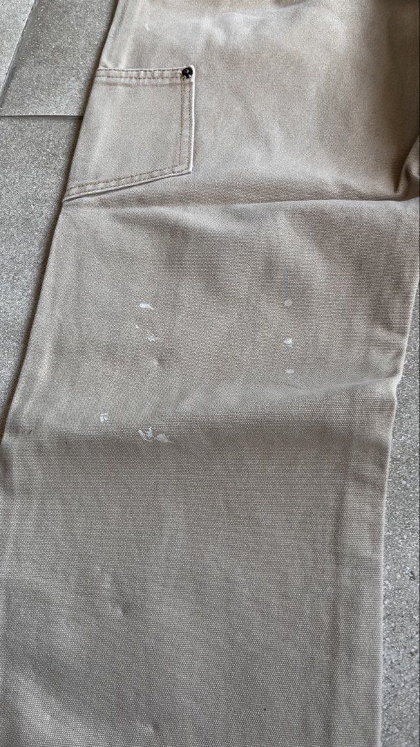 Orchard Supply Hardware Tan Canvas Carpenter Pants (Category: Jeans) located in Cabuyao City. Submitted by bulandos (Listing ID 1470657068, Image 3). Description: - Brand: Orchard Supply Hardware - Material: Heavy-duty tan duck canvas - Style: Utility carpenter pants with relaxed fit - Features: Multiple tool pockets, hammer loop, and reinforced stitching - Condition: Authentic workwear with genuine paint splatters and stains on lower legs and th