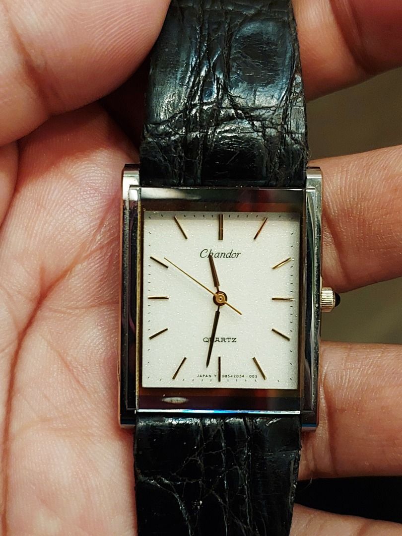 Orient Chandor Quartz Rectangular Watch Black Leather Strap (Category: Men's Watches) located in Batangas. Submitted by vintageanddainty (Listing ID 1470583256, Image 2). Description: - Brand: Chandor - Movement: Quartz - Dial: White rectangular face with gold hands and hour markers - Crown: Accented with a dark cabochon stone - Strap: Slim black leather with crocodile texture embossing - Style: Classic dress watch, comfortable for daily wear.