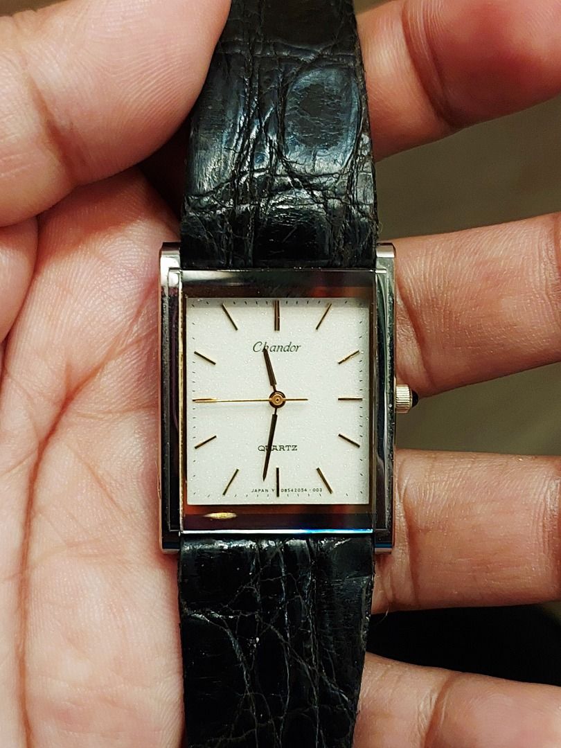 Orient Chandor Quartz Rectangular Watch Black Leather Strap (Category: Men's Watches) located in Batangas. Submitted by vintageanddainty (Listing ID 1470583256, Image 1). Description: - Brand: Chandor - Movement: Quartz - Dial: White rectangular face with gold hands and hour markers - Crown: Accented with a dark cabochon stone - Strap: Slim black leather with crocodile texture embossing - Style: Classic dress watch, comfortable for daily wear.