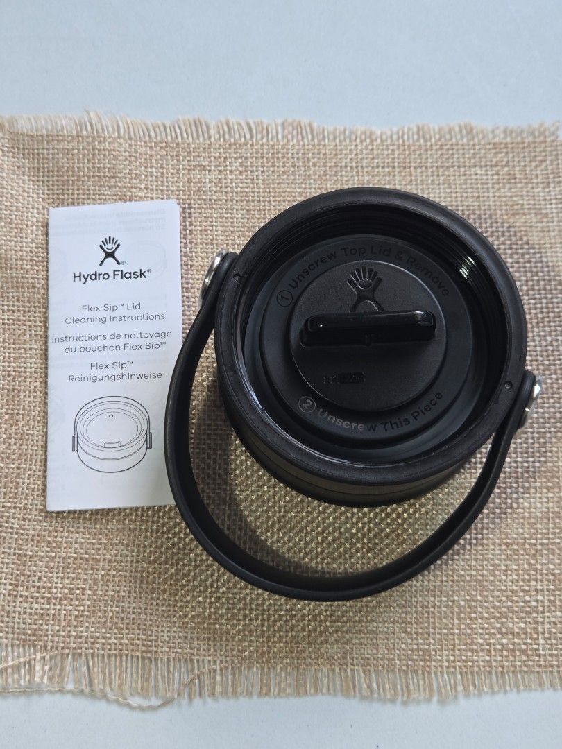 Original Hydro Flask Flex Sip Lid cap (Category: Water Bottles & Tumblers) located in Bulacan. Submitted by limitless.melai (Listing ID 1470557657, Image 2). Description: - Authentic Hydro Flask Flex Sip Lid in sleek black - Fits all standard wide mouth bottles - Convenient twist-to-open sip mechanism for easy drinking on the go - Brand new, never used, and in pristine condition - Includes original cleaning instructions booklet.