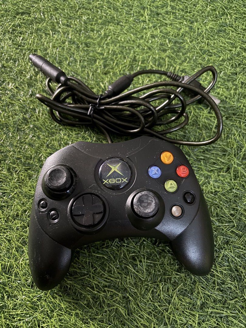 Original Microsoft Xbox Controller S Black (Category: Controllers) located in Makati City. Submitted by rare_thrift_stuff (Listing ID 1470612753, Image 1). Description: - Genuine Microsoft Xbox Controller S in classic black - Includes wired setup with original breakaway cable - Features standard thumbsticks, D-pad, and action buttons - Made in Malaysia with serial number sticker intact on the back - Fully compatible with the original Xbox console