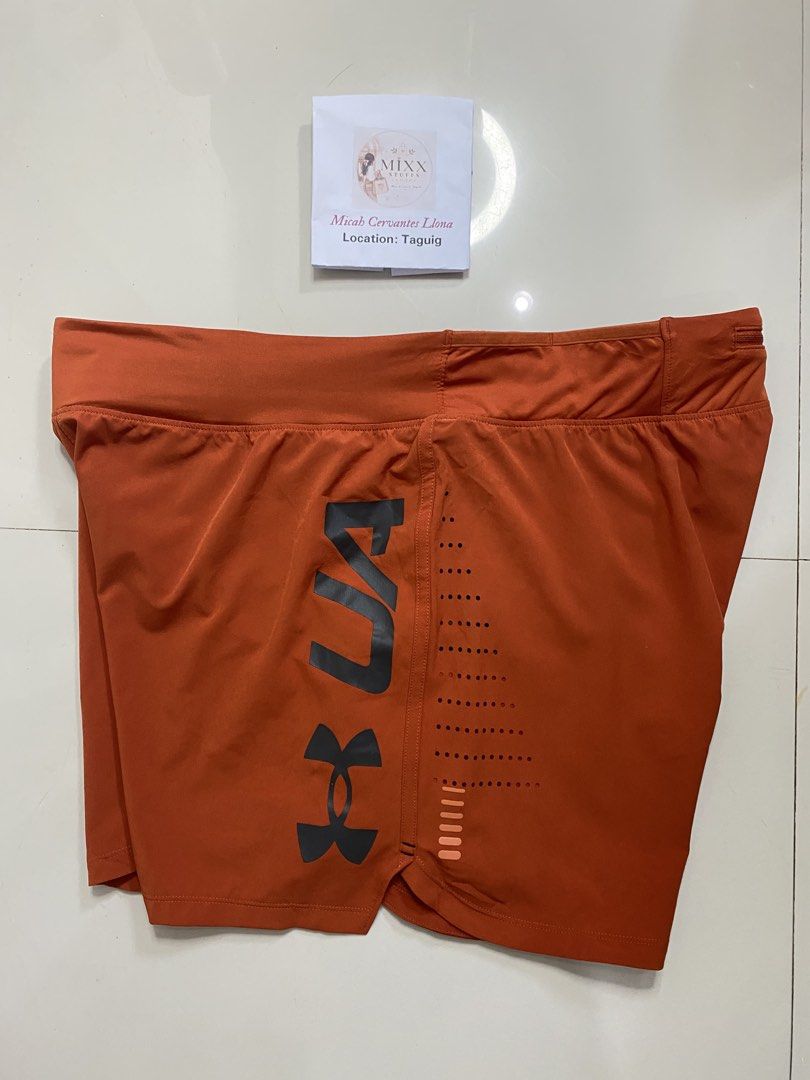 Original Under Armour Speedpocket Orange Athletic Shorts (Category: Shorts) located in Taguig. Submitted by mixxstuffsshopii (Listing ID 1470601708, Image 2). Description: 👉Original Under Armour Mens's Speedpocket with Inner brief size XL 👉Price: 950 👉Size : L- 15"/ Waist- 34"-42" Stretch 👉Very Good Condition 👉Location: Central Signal Taguig #UnderArmourSpeedpocketShort #MixxStuffsShop #AllOriginal.