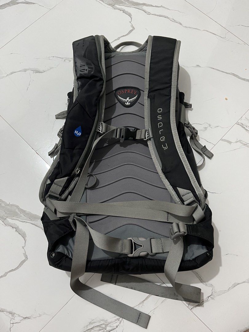 Osprey Karve 16 Black Backpack (Category: Backpacks) located in Manila. Submitted by obedmagall74424 (Listing ID 1470613187, Image 2). Description: - Brand/Model: Osprey Karve 16 Daypack - Color: Black with grey accents and front pocket graphic tower print - Comfort & Fit: Padded back panel, ergonomic shoulder straps, and multiple adjustment straps - Features: Hydration tube port included - Origin: Made in Vietnam - Condition: Clean interior and 
