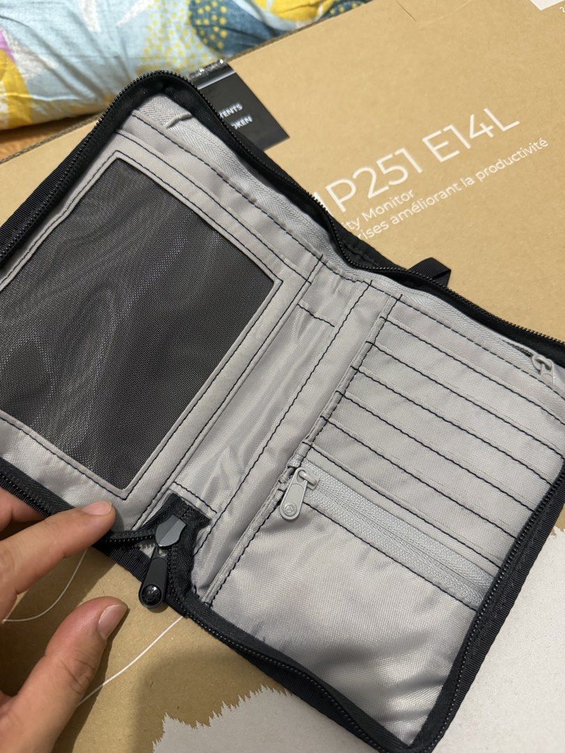 Pacsafe RFIDsafe Z150 RFID Blocking (TRAVEL ABORAD) (Category: Luxury Bags & Wallets) located in Santa Rosa. Submitted by justuniqloph (Listing ID 1470641626, Image 2). Description: - Brand: Pacsafe - Model: RFIDsafe Z150 Compact Organiser - Color: Grey - Condition: Used stil have the with original tag attached - Security: Built-in RFID-blocking technology to protect against electronic theft - Interior Features: Multiple card slots, secure zipper