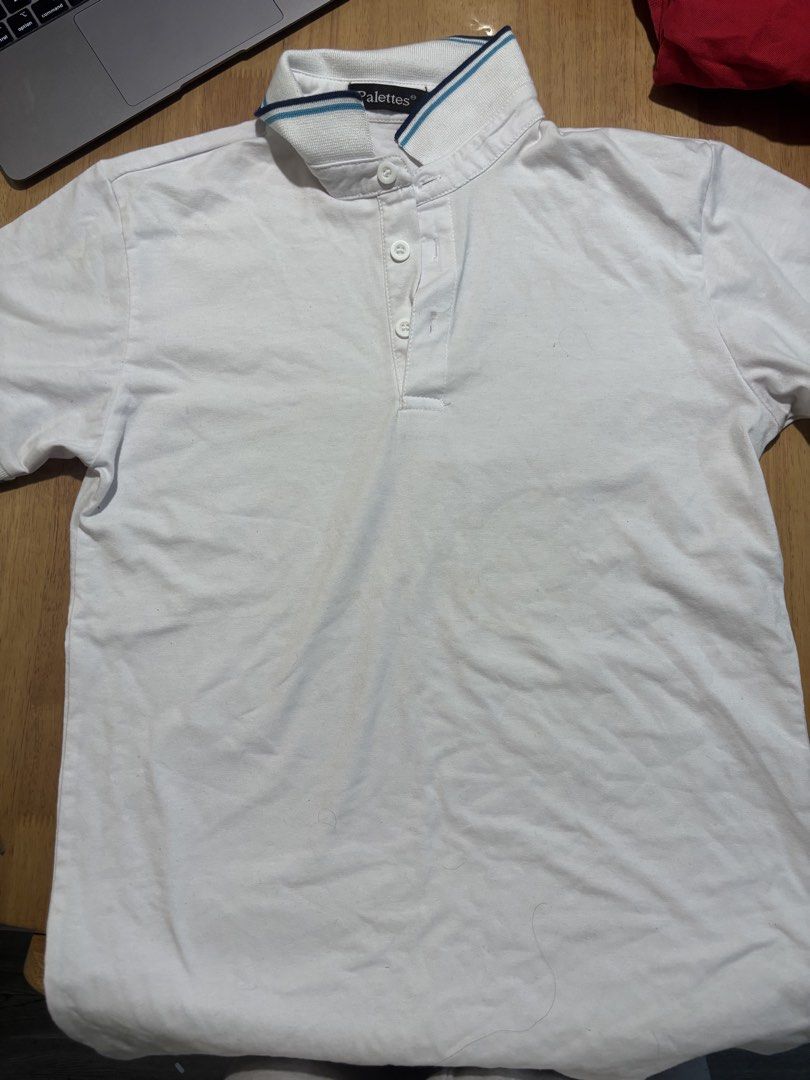 Palettes White Polo Shirt Size S (Category: Tshirts & Polo Shirts ) located in Manila. Submitted by ninja2130 (Listing ID 1470588245, Image 1). Description: - Brand: Palettes - Color: White with blue and navy stripe details on the collar - Size: Small - Material: Lightweight cotton for all-day comfort - Features: Short sleeves, standard collar, and a 3-button placket - Condition: Pre-owned with normal signs of washing and wear.
