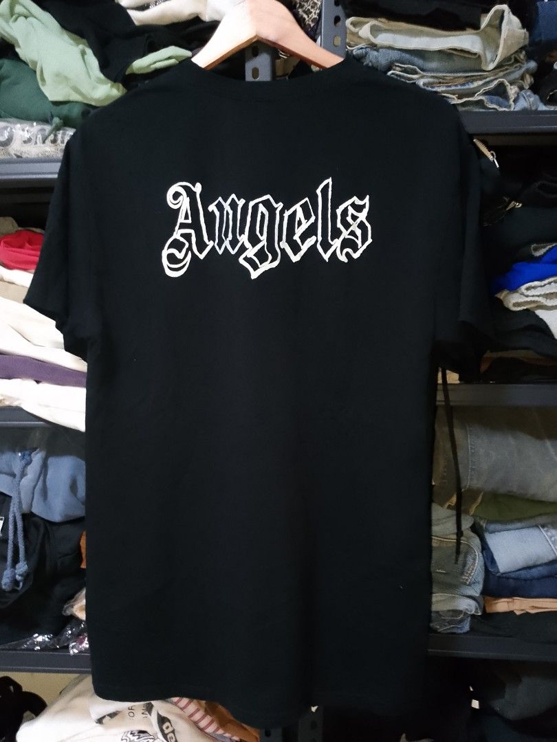 Palm Angels Black Tee Size M (Category: Tshirts & Polo Shirts ) located in Manila. Submitted by mjthrifted_second (Listing ID 1470616977, Image 2). Description: - Brand: Palm Angels - Color: Black with white gothic logo (chest and back) - Size: Medium (Regular Fit) -Dimes: 21/29 - Material: 100% Cotton, Made in Italy - Condition: Brand new with tags and care label - Style: Classic crew neck, short sleeves - 100% Authentic & high quality.