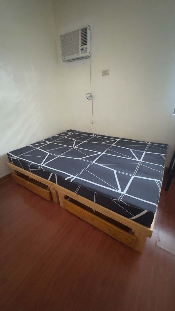 Palochina bed frame with 6inch mattress (Full Double) (Category: Bed Frames & Mattresses) located in Manila. Submitted by youngforest-1b9e (Listing ID 1470694241, Image 1). Description: - Size: Full Double (54” x 75”) - Type: Varnished palochina wood bed frame with natural finish - Storage: 2 smooth, wheel-mounted pull-out drawers underneath (missing one handle) - Included: Black and white geometric patterned mattress (6 inch thknss) - Condition: