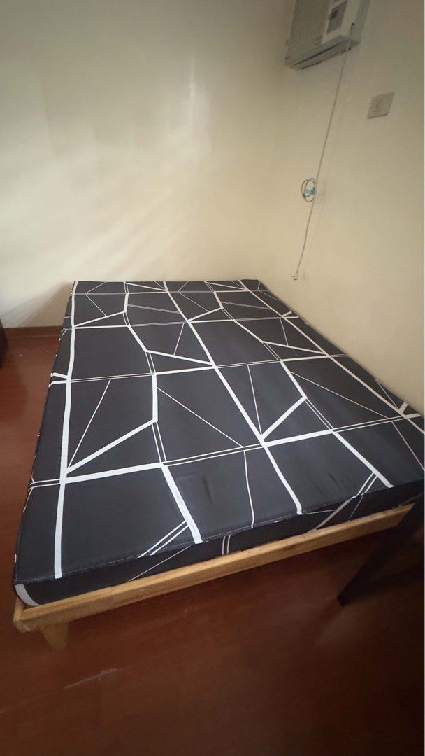 Palochina bed frame with 6inch mattress (Full Double) (Category: Bed Frames & Mattresses) located in Manila. Submitted by youngforest-1b9e (Listing ID 1470694241, Image 2). Description: - Size: Full Double (54” x 75”) - Type: Varnished palochina wood bed frame with natural finish - Storage: 2 smooth, wheel-mounted pull-out drawers underneath (missing one handle) - Included: Black and white geometric patterned mattress (6 inch thknss) - Condition: