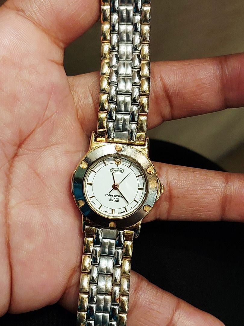 Pa-Nero Milano Two-Tone Quartz Watch (Category: Women's Watches) located in Batangas. Submitted by vintageanddainty (Listing ID 1470582938, Image 2). Description: - Brand: Pa-Nero Milano - Dial: White dial with elegant gold-tone hour markers - Bracelet: Two-tone silver and gold stainless steel link bracelet - Case: Round case with a stylish textured bezel and stainless steel case back - Movement: Battery-operated with reliable Japan movement and 