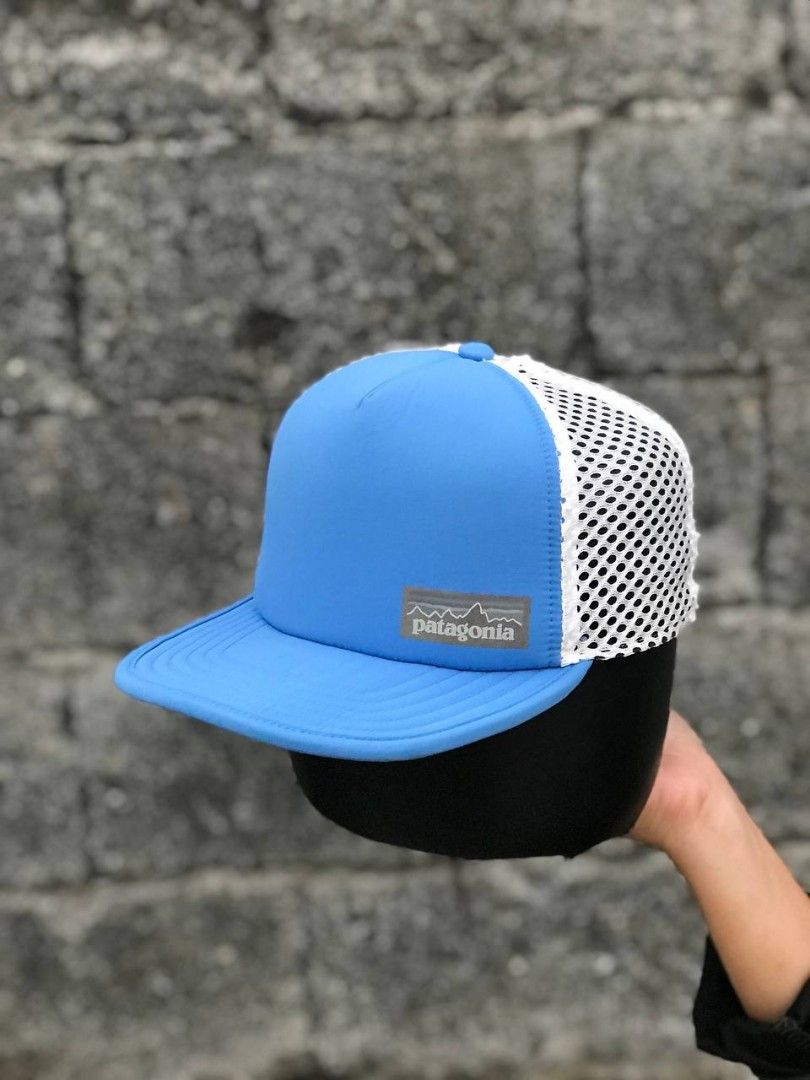 Patagonia Blue Duck Bill (Category: Caps & Hats) located in Manila. Submitted by jowiegarci63146 (Listing ID 1470562070, Image 2). Description: - Authentic Patagonia trucker hat in bright blue and white - Classic foam front panel with iconic woven mountain logo patch - Clean white mesh backing for breathability - Adjustable snapback closure for a customizable fit.