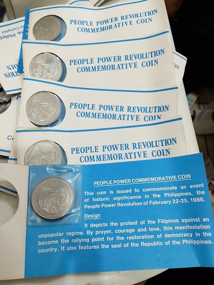 People Power Revolution commemorative coins (Category: Announcements) located in Quezon City. Submitted by coinsandbanknotes (Listing ID 1470656574, Image 2). Description: 100 each UNC.