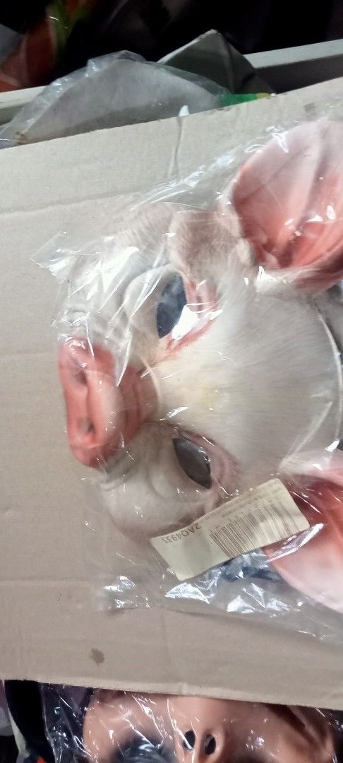 Pig Mask Costume Accessory (Category: Occasions & Party Supplies) located in Paranaque City. Submitted by dimaguilaa24827 (Listing ID 1470649078, Image 1). Description: - Brand new and unopened in original plastic packaging - Features a creepy design with a realistic pink snout and big ears - Detailed with faux hair texture for an extra spooky look - Perfect for Halloween costumes, parties, and cosplay - Ready for fast shipping or meet-up.